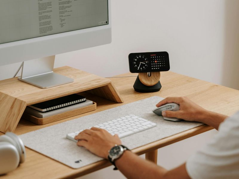 Minimalist desk with a plant representing a calm workspace