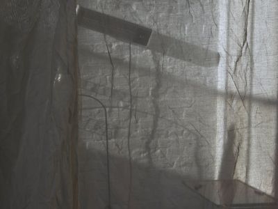 Soft light hitting a textured wall in a room